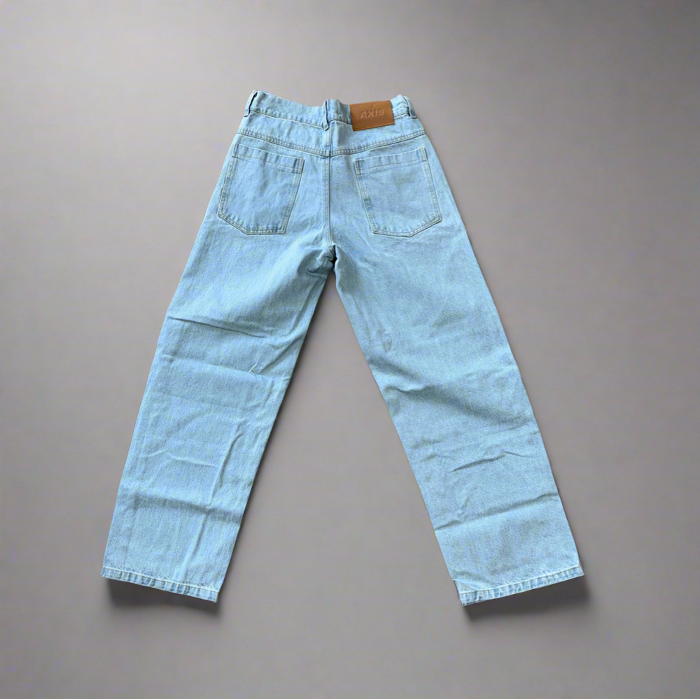 Light blue jeans on a beige background