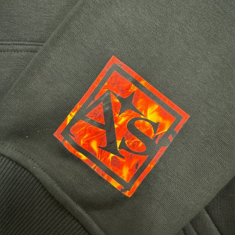 Black jacket with a fiery logo on a dark background